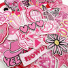 Assorted pink embroidered iron-on patches featuring various designs like hearts flowers and text for DIY clothing