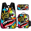 A set of three graphic cartoon print backpacks featuring a stylized shark head and crown design in vibrant colors.