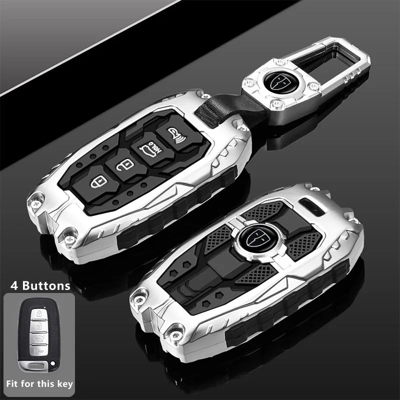 Silver protective key fob cover with four buttons shown against a dark background.