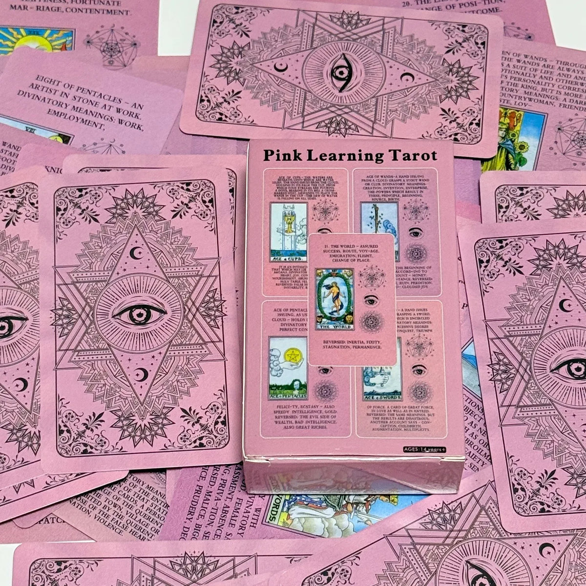 A box of Pink Learning Tarot cards featuring various spreads and illustrations.