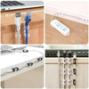 Various self-adhesive cable clips and organizers used for managing electronic cords and cables.