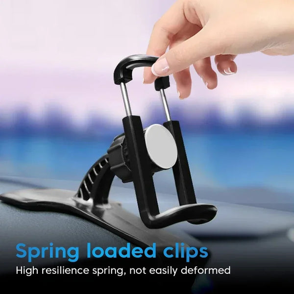 Une main tient un support de téléphone à clip à ressort noir, conçu pour une voiture.