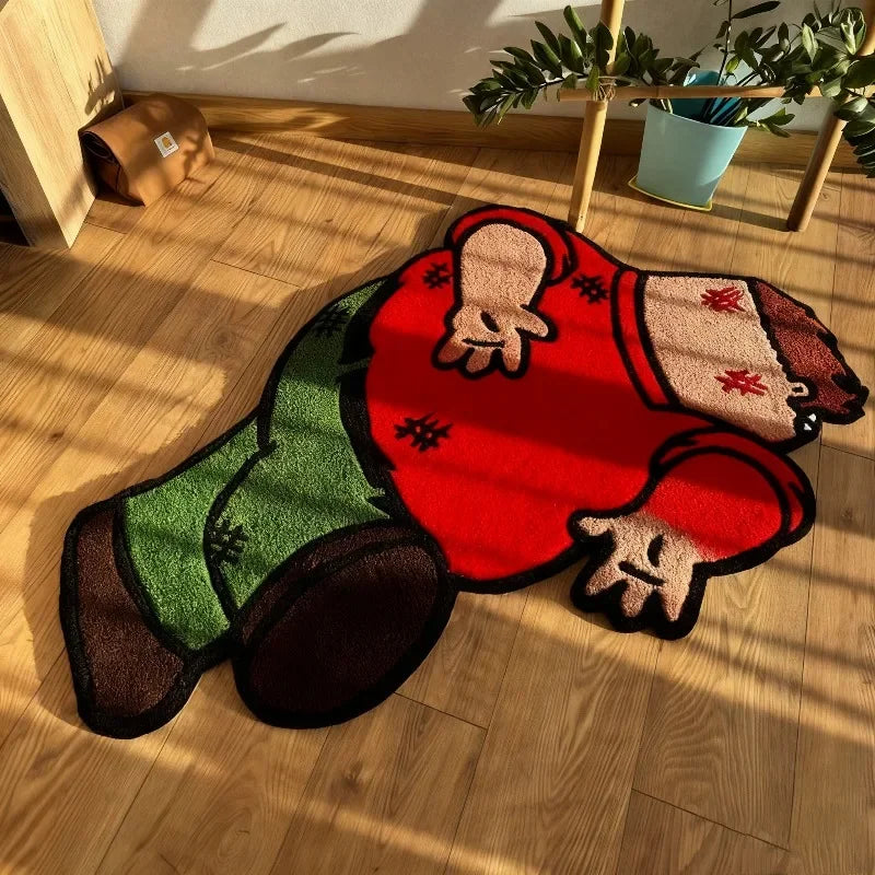 A playful cartoon carpet featuring a red body with green pants and dark boots, lying on a wooden floor.