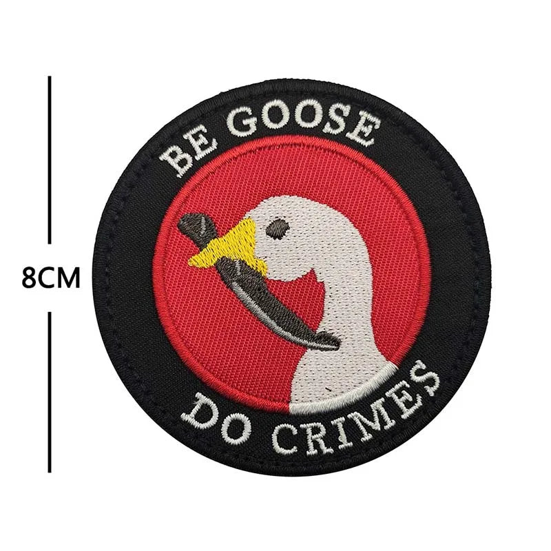 Black applique patch featuring a white goose head silhouette against a red background with the text BE GOOSE DO CRIMES