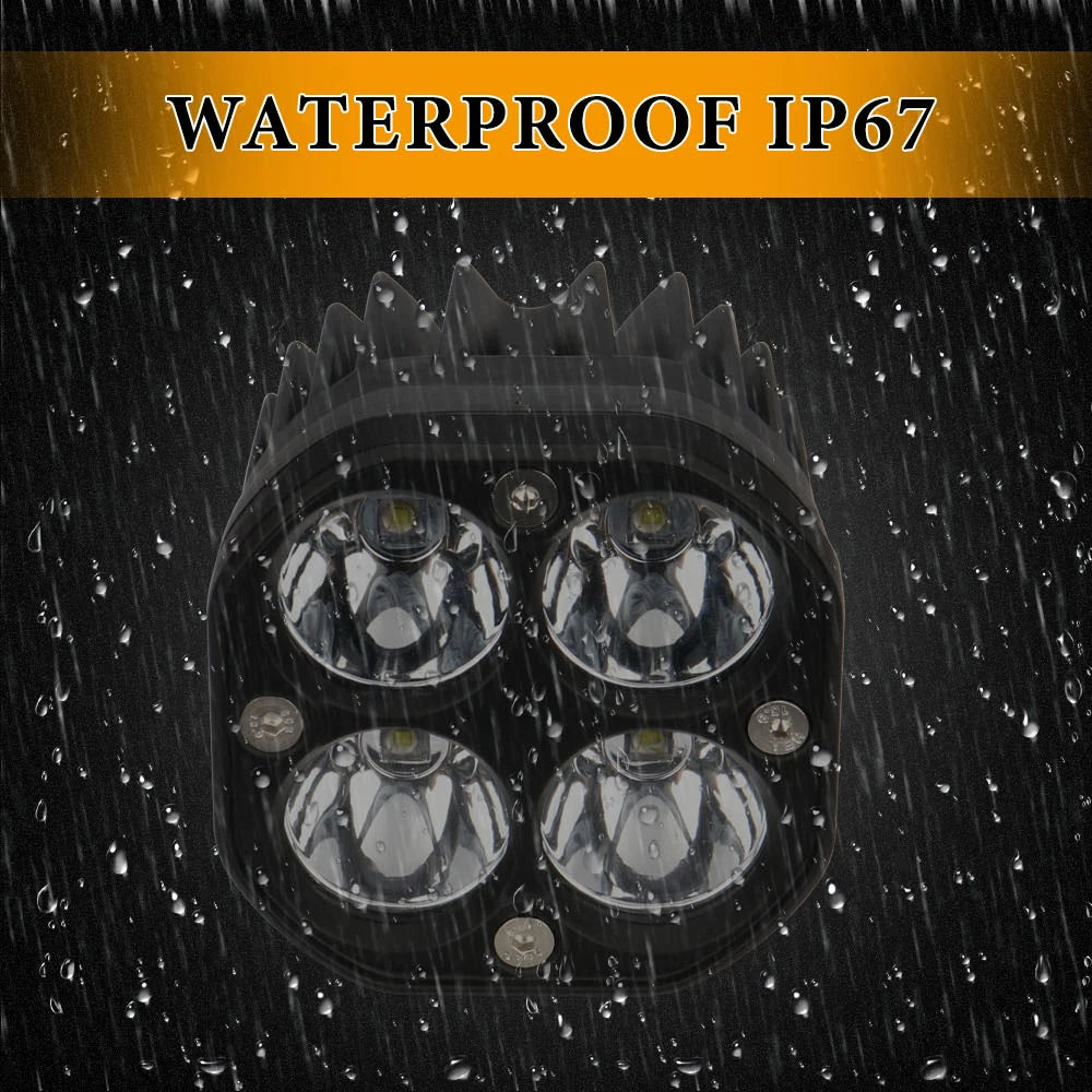 Close-up view of an IP67 waterproof LED spotlight housing with four lenses against a dark background.