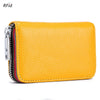 A yellow genuine leather card holder with a zipper and RFID protection feature.