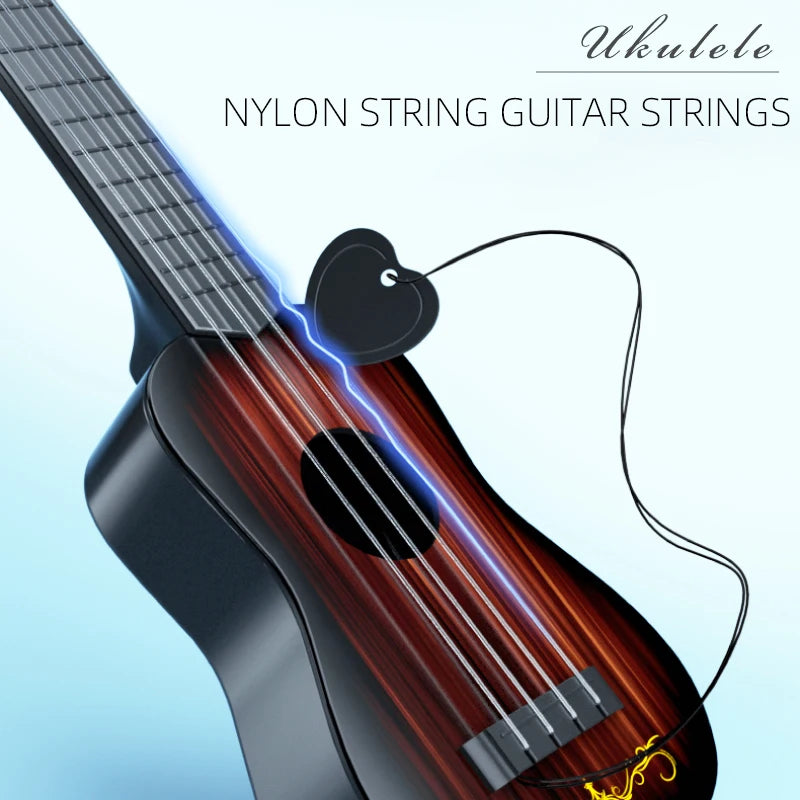 A close-up of a dark wood ukulele showing nylon string guitar strings and a pick.