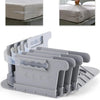 A set of four gray adjustable bed sheet corner holders designed to secure linens on a bed.