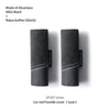A pair of black Alcantara and Napa leather car roof handle covers for the Sport Series.