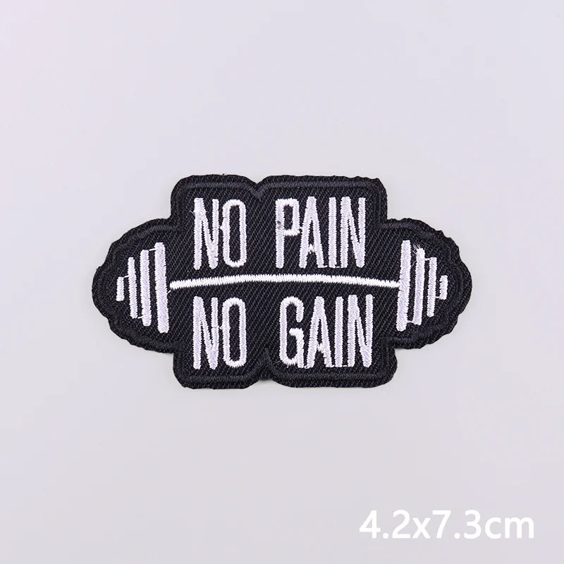 Black embroidered iron-on patch with the text NO PAIN NO GAIN stitched in white thread