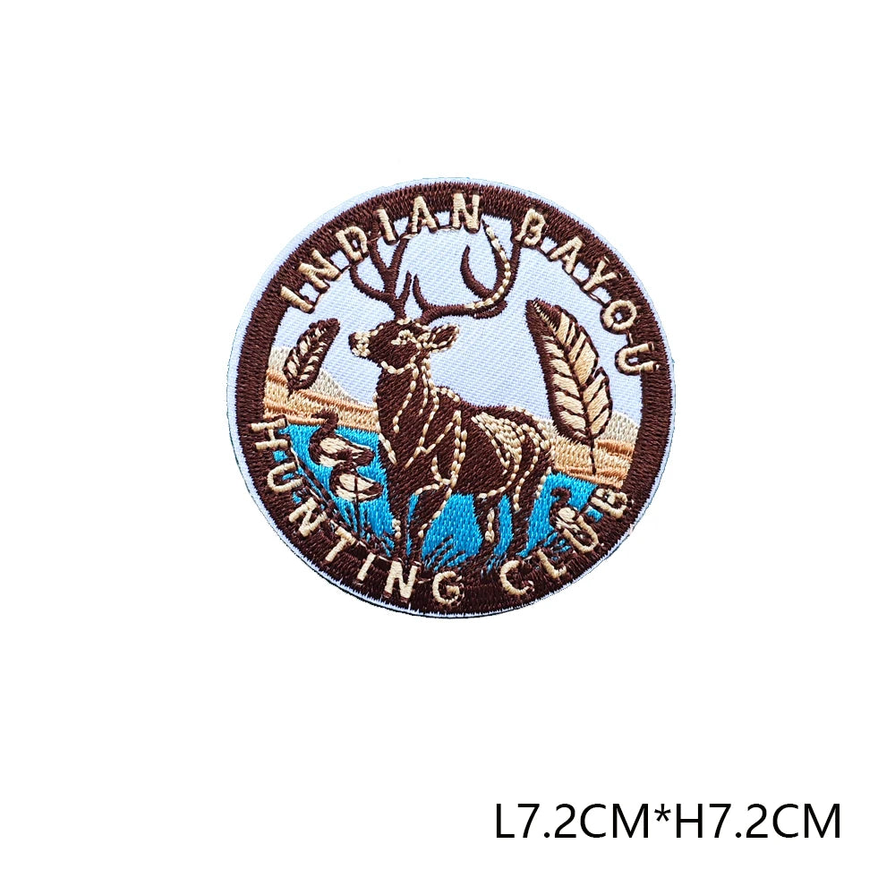 A round embroidered patch featuring a deer head silhouette and text for an Indian Bay hunting club.