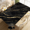 Black gold marble waterproof tablecloth displayed on a wooden floor with white chairs.