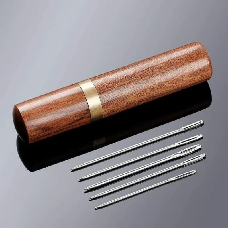 A wooden case containing a set of twenty-five sewing needles with various sizes.