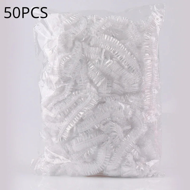 A clear plastic bag containing 50 pieces of disposable transparent waterproof shower caps.