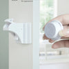 A hand holds a white magnetic safety lock designed for built-in installation.