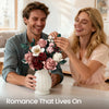 A couple is admiring a pink rose bouquet, illustrating romance that lives on.