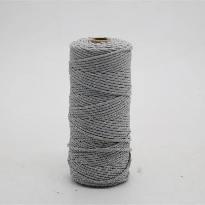 A spool of gray macrame cord, 3mm/4mm thickness, used for crafting.