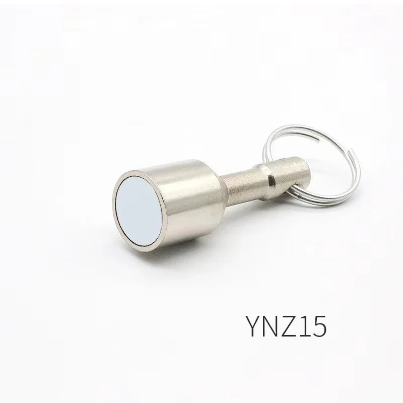 A silver neodymium magnet keychain with a cylindrical body and a circular face is shown against a white background.