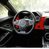Interior view of a Chevrolet Camaro showing red trim and steering wheel.