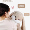 A person is holding an oversized long-eared angry rabbit plush toy, demonstrating its soft texture and design.