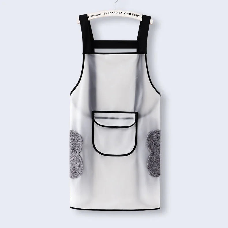 A white kitchen apron with black trim and a pocket, featuring gray textured fabric details.