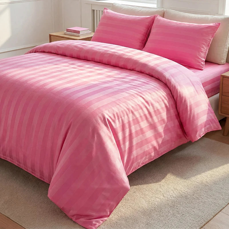 Pink satin striped jacquard duvet cover set with matching pillows on a bed.