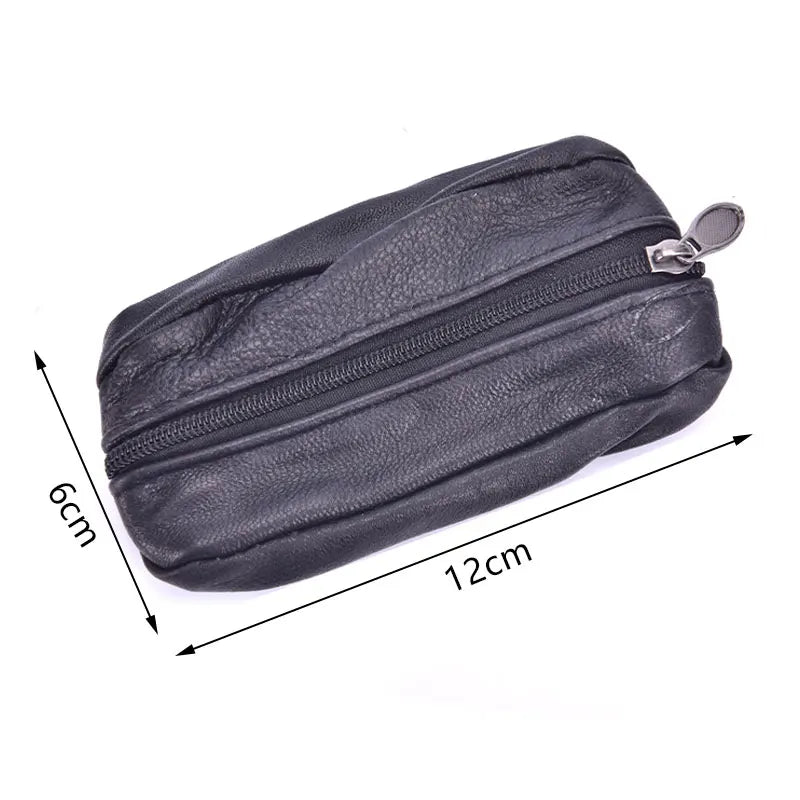 A black leather compact zippered coin purse with a metal key holder attached.