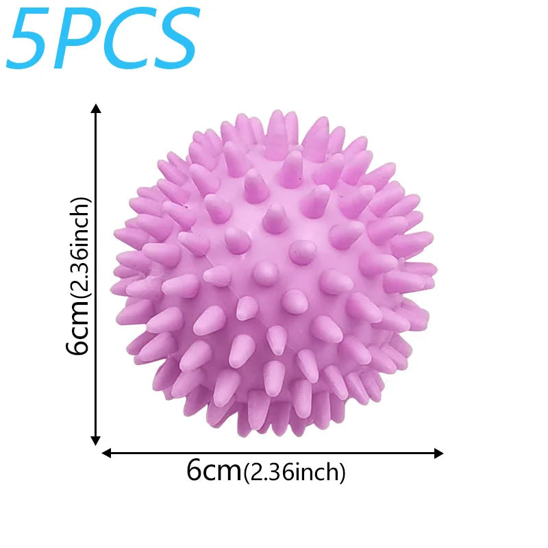 Five pink reusable laundry balls used for fluffier and faster drying