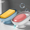A yellow leaf-shaped suction cup soap dish is shown dispensing water in a bathroom setting.