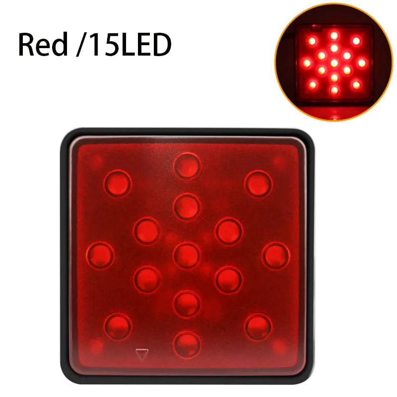 A square red LED light module with multiple circular lenses for a trailer tail light.