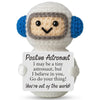Handmade crochet astronaut doll with a positive message card that says I believe in you go do your thing