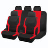 A set of four black and red two-tone car seat covers shown side by side.