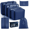 A set of navy blue travel packing cubes and storage organizer bags for clothing and items
