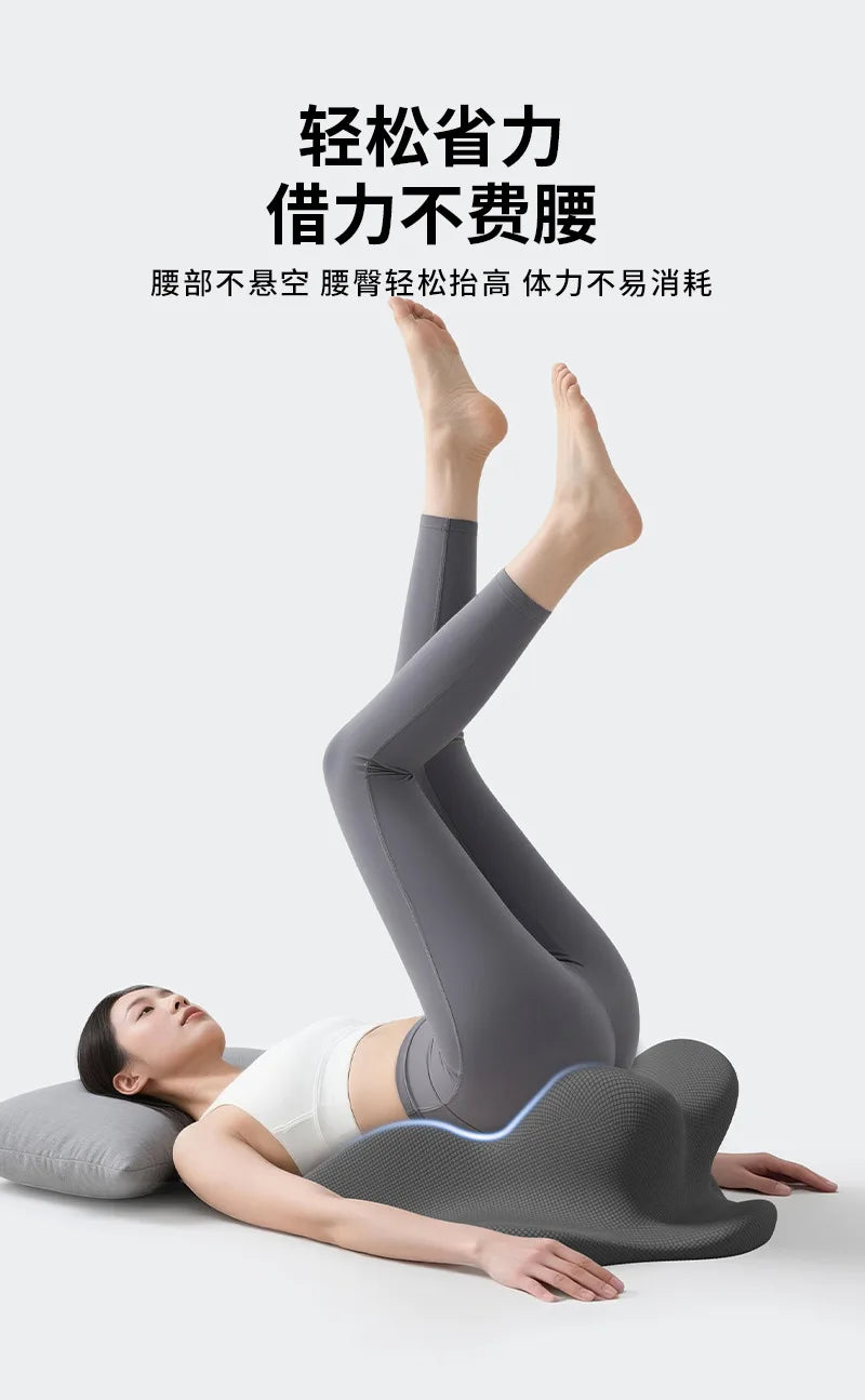 A person lying down with legs raised, wearing gray compression leggings, demonstrating the lightness of the leg muscle.