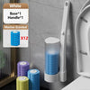 Wall-mounted disposable toilet brush set with white and marine-scented replacement heads displayed against a gray wall.