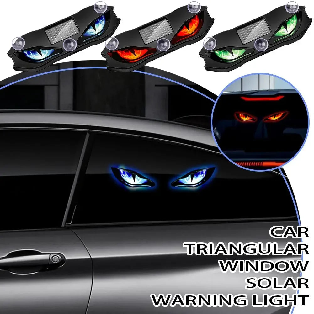 A set of triangular window warning lights featuring demon eye designs installed on a black car.