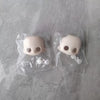 A pair of white articulated BJD collectible figurines packaged in clear plastic bags