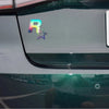 A reflective decal featuring a colorful R and a star on a car window.