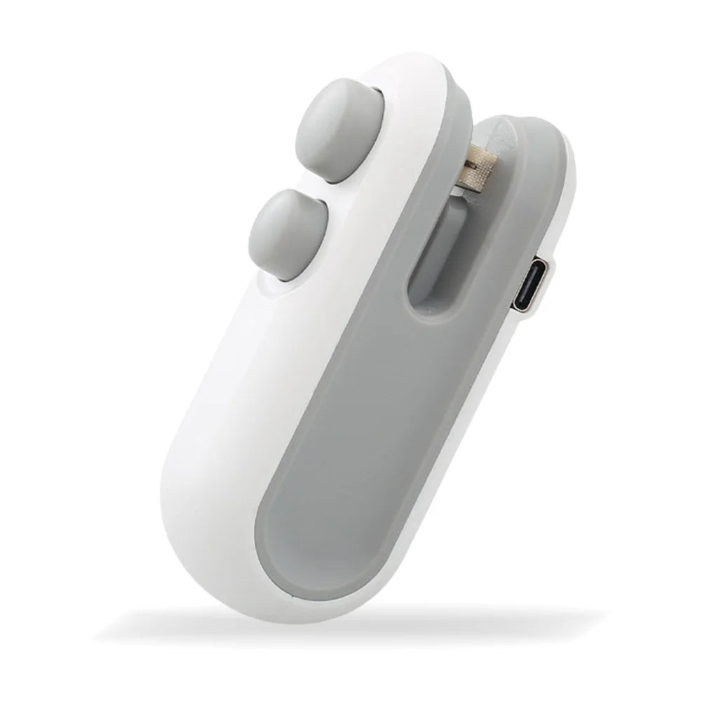 A white and gray portable 2-in-1 bag sealer and cutter device shown from above.