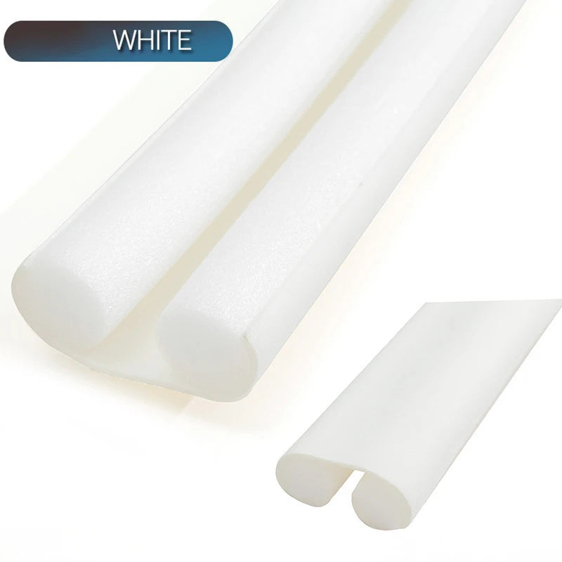 A white flexible door bottom seal strip shown in a close-up view.