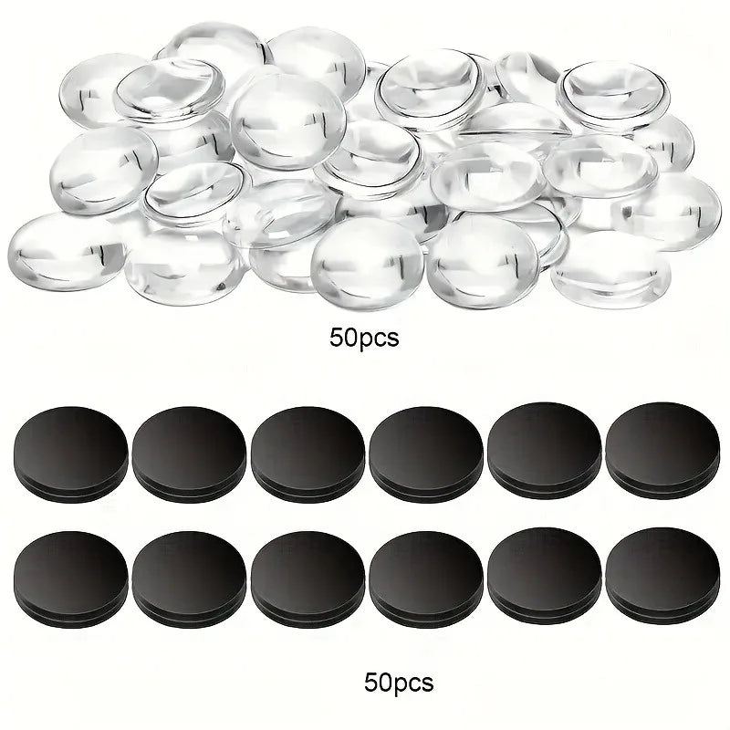 A collection of 50 clear glass domes and 50 black magnets for a making kit.