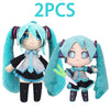 Two soft teal plush dolls of Hatsune Miku anime style figures with long hair and headphones