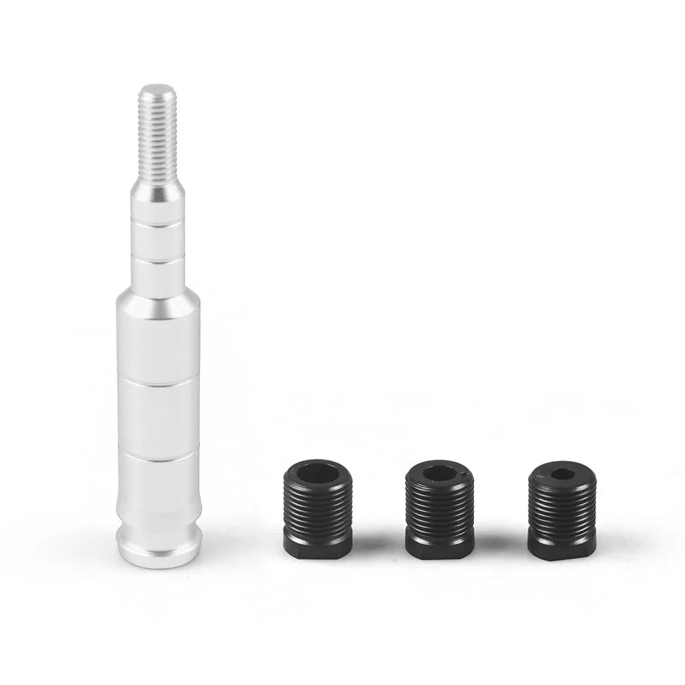 A set of aluminum shift knob extenders, including a threaded metal rod and several black threaded inserts.