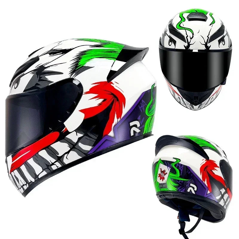 A black and white motorcycle helmet featuring green, red, and purple graphics with a removable liner.