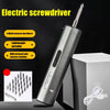 A silver electric screwdriver with a screwdriver bit is shown against a dark background, next to its charging cable.