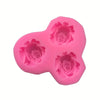 A pink silicone rose mold with four flower shapes for crafting resin, clay, soap, and candles.