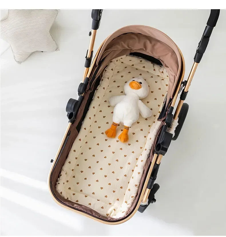 A beige and brown stroller cushion featuring a white cartoon duck toy inside.
