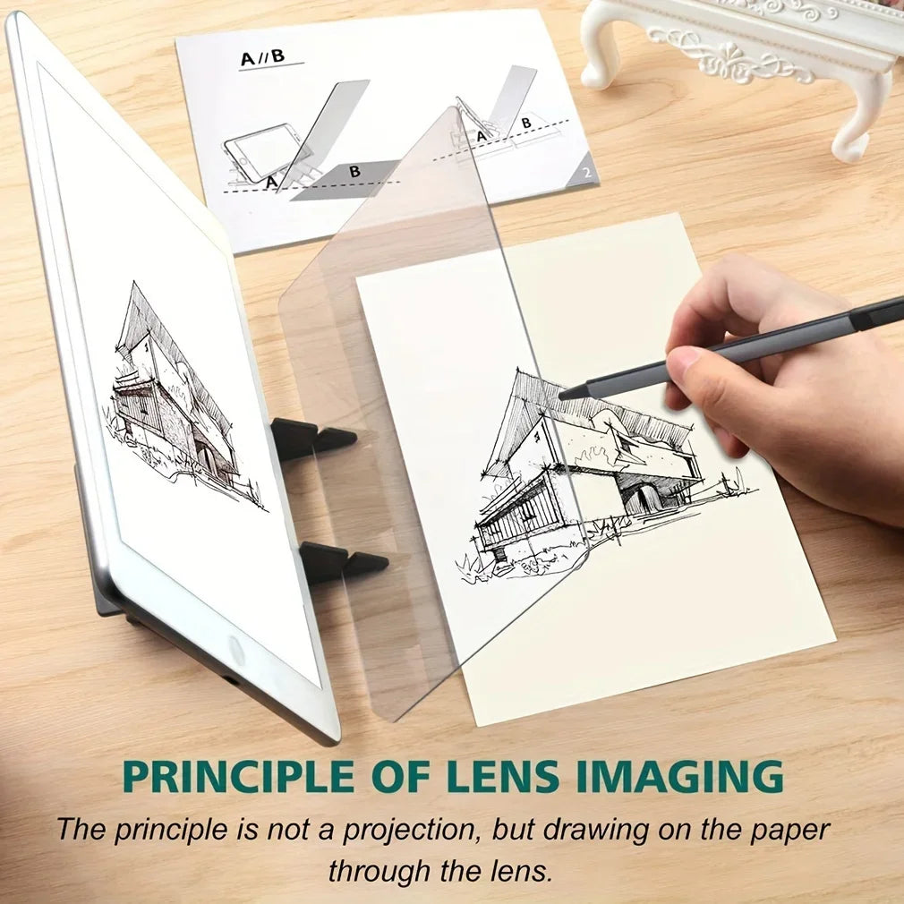 A hand draws a building outline on paper through a clear lens onto an optical tracing board.