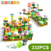A green and yellow flower garden building toy set with various colorful flowers and plants for kids