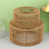 A cylindrical lampshade made of woven paper rope in a natural brown color.